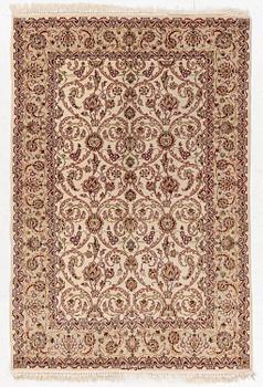 An Isfahan, part silk rug, signed, c. 165 x 112 cm.