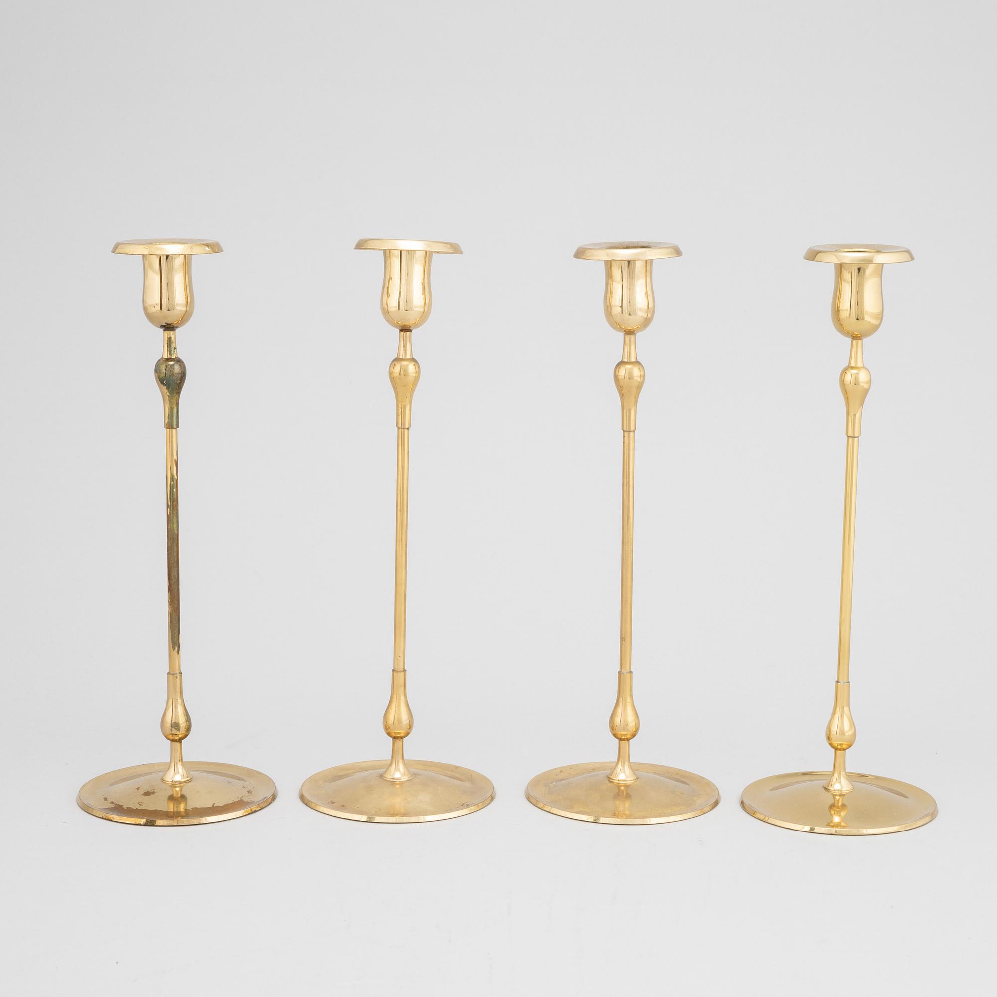 Gunnar Ander, a set of four brass candlesticks from Ystad Metall.