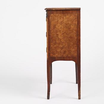 A Louis XVI-style parquetry commode, circa 1900.