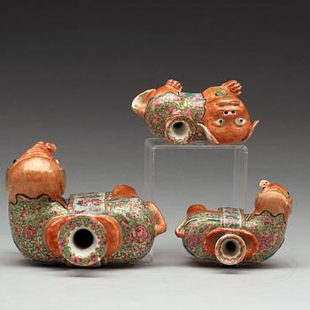 A group of Canton famille rose candle sticks, late Qing dynasty, early 20th Century.