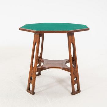 An early 1900s oak game table.