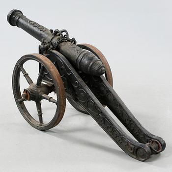 A small cast iron cannon, 19th or early 20th century.