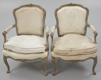 A pair of  Rococo style armchairs, circa 1900.