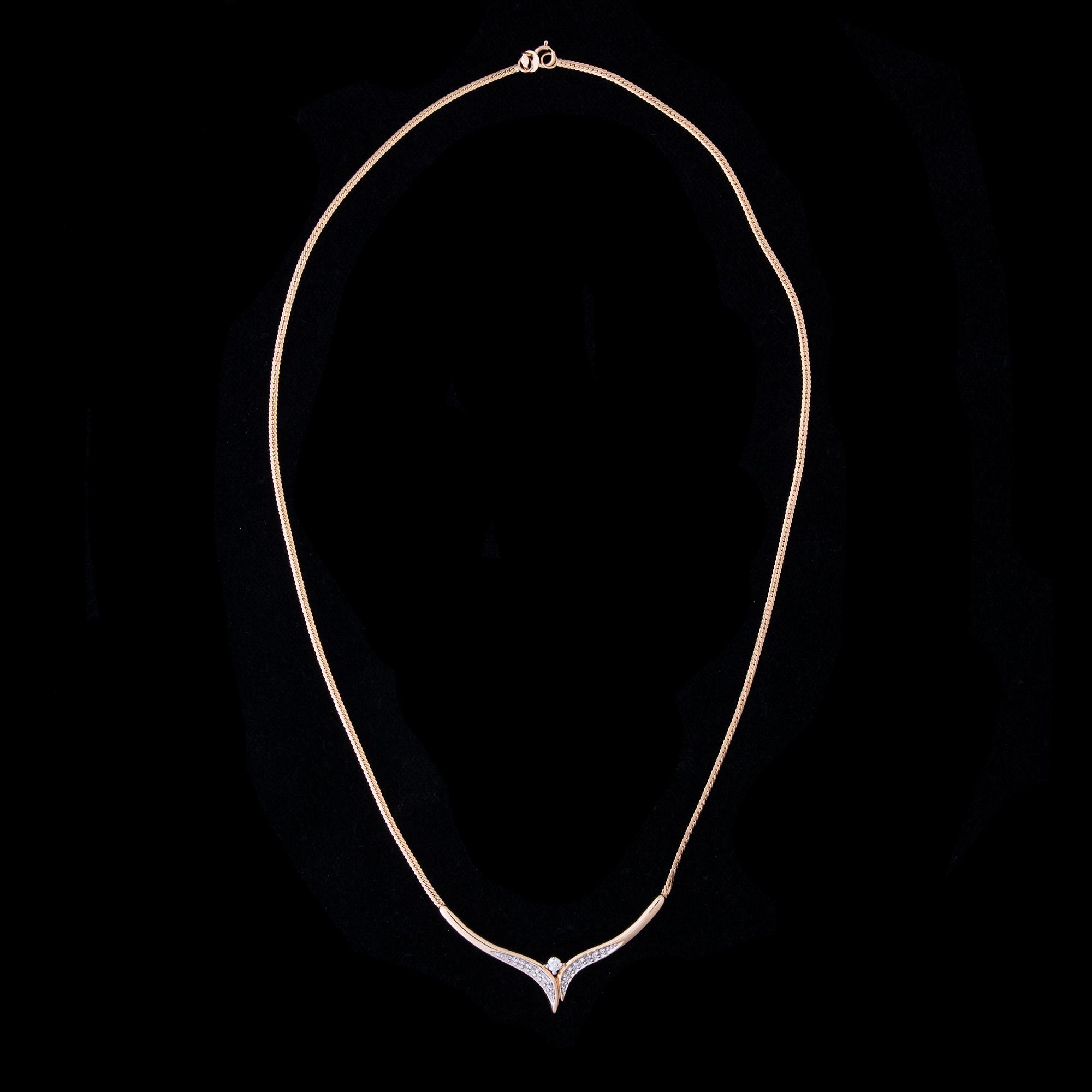Halssmycke, 14K guld, briljantslipade diamanter. Vikt ca 5,0 g.