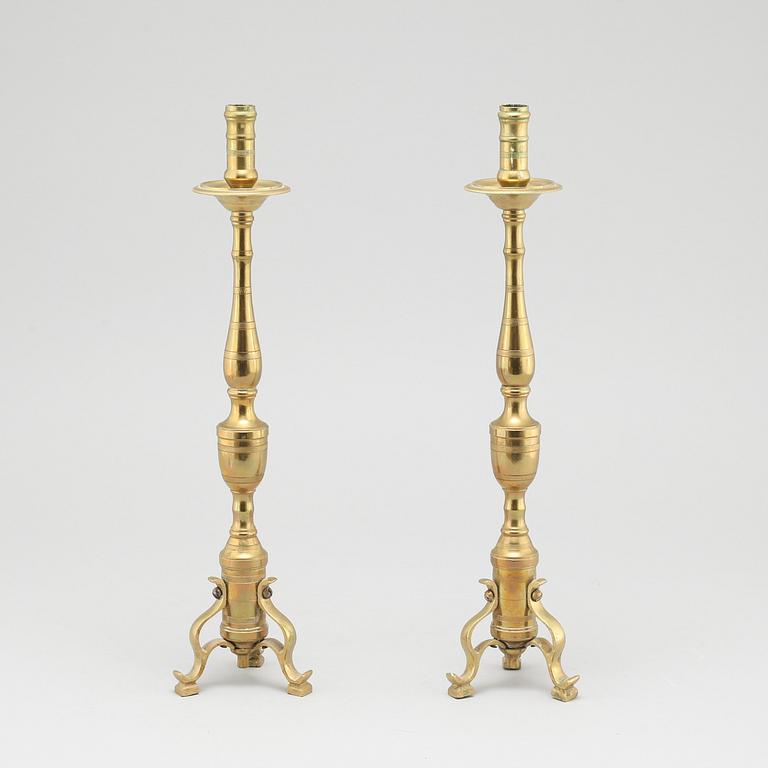 A pair of brass candlesticks, made around year 1900.