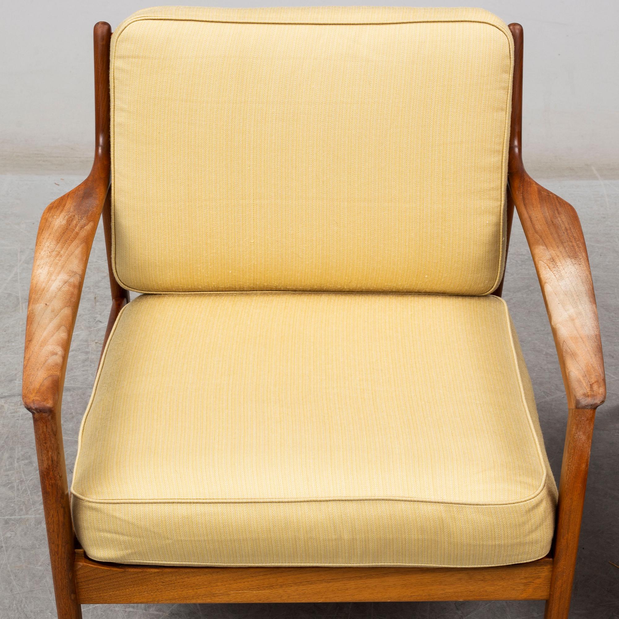 A pair of USA-75 easy chairs by Folke Ohlsson, DUX.