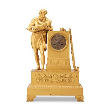 1677. A French Empire early 19th century gilt bronze mantel clock.
