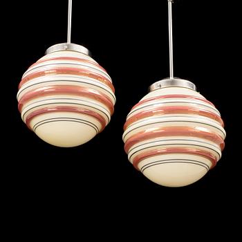 A pair och metal and and glass ceiling lights from the 1940s. Height ca 59 cm.