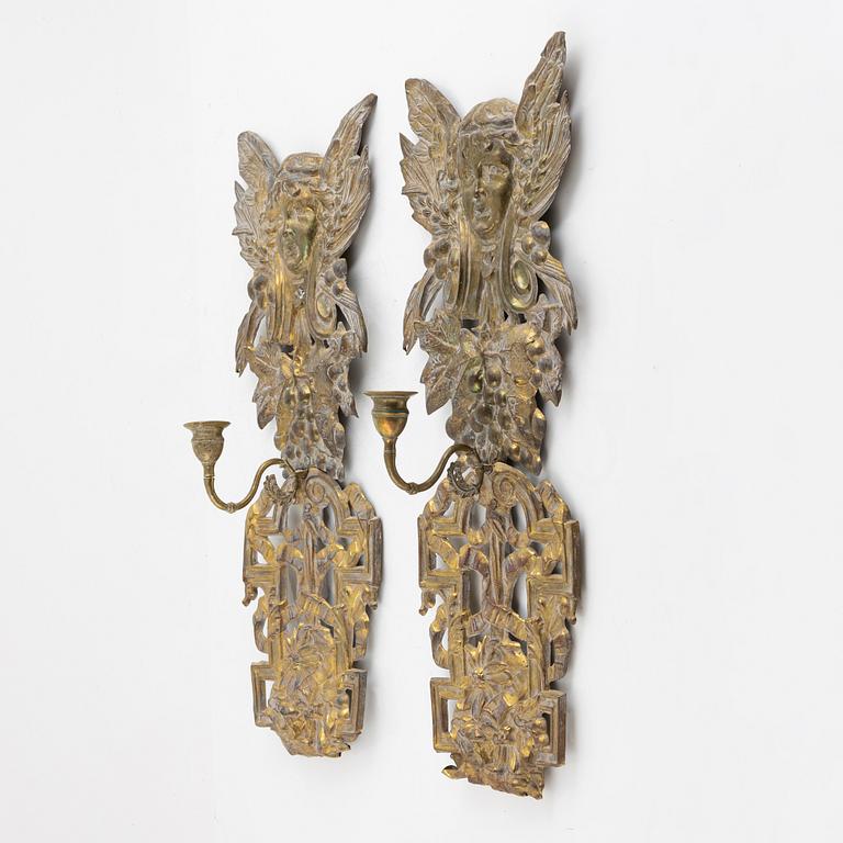 A pair of brass wall sconces, circa 1900.