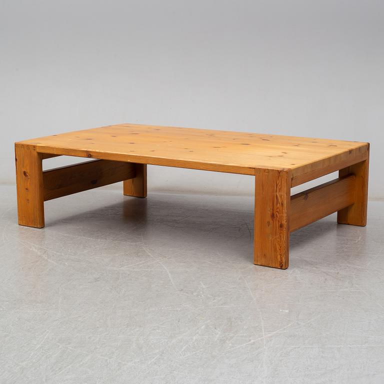 A 1960s pine coffee table.