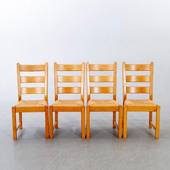 A set of four wicker and oak 1970s chairs.