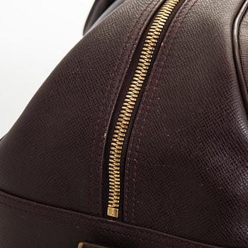 Louis Vuitton, a 'Taiga Kendall PM' weekend bag.