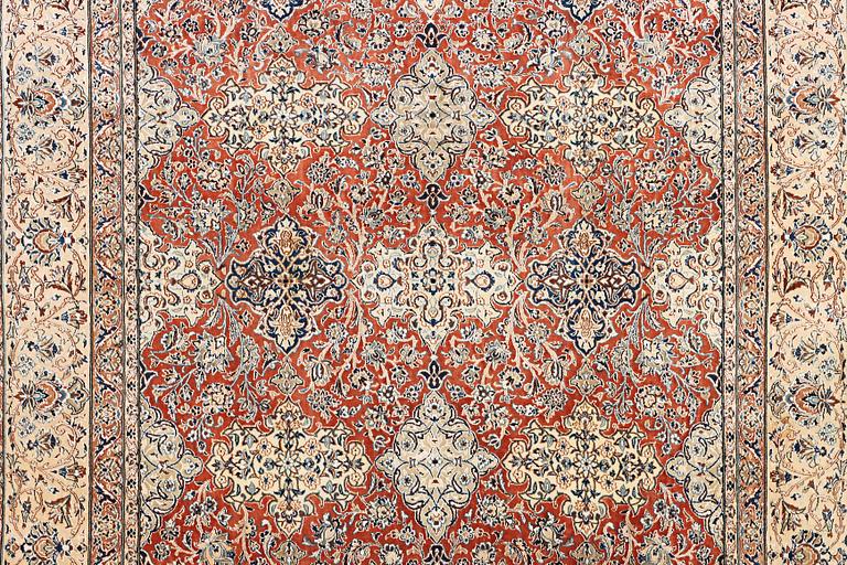 A semi-antique/old Nain carpet, part silk, c. 343 x 230 cm.