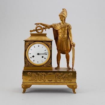 An empire mantel clock, first half of the 19th century.