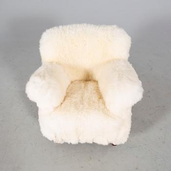 A 1940/50s cheep skin armchair.