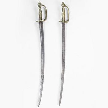 A pair of Swedish 18th Century cutlasses.