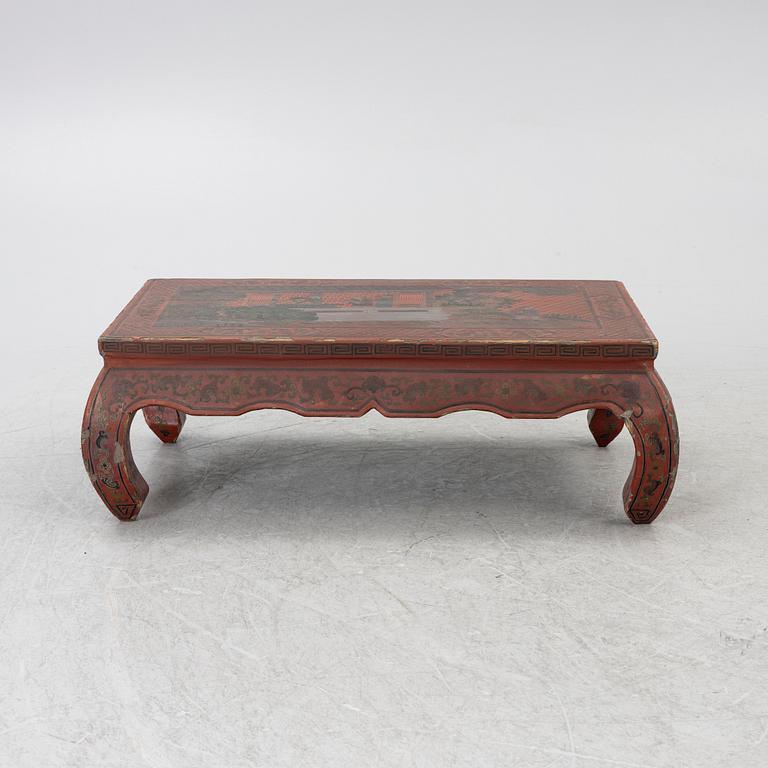 A Chinese red lacquered table, first quater of the 20th century.