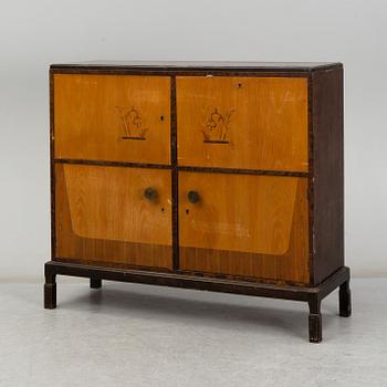 A 1930s cabinet by E. Pettersson, Gefle, Sweden.