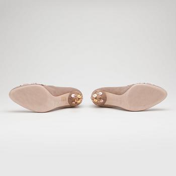 MIU MIU, a pair of beige suede pumps with sequined embellishment.