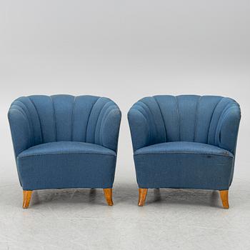 A pair of 1950's armchairs.