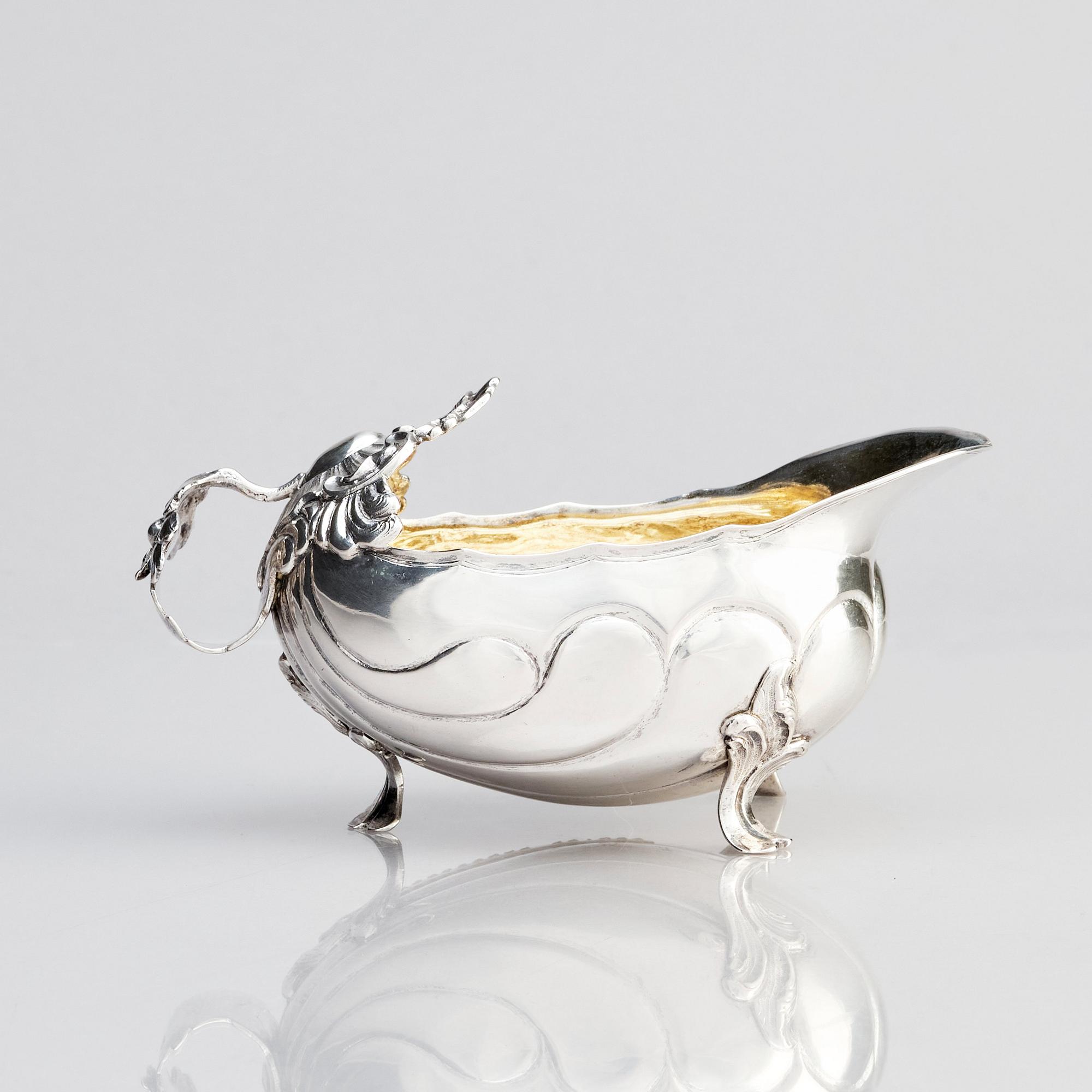 A Swedish parcel-gilt silver cream-jug, mark of Daniel Lundström, Stockholm 1764.