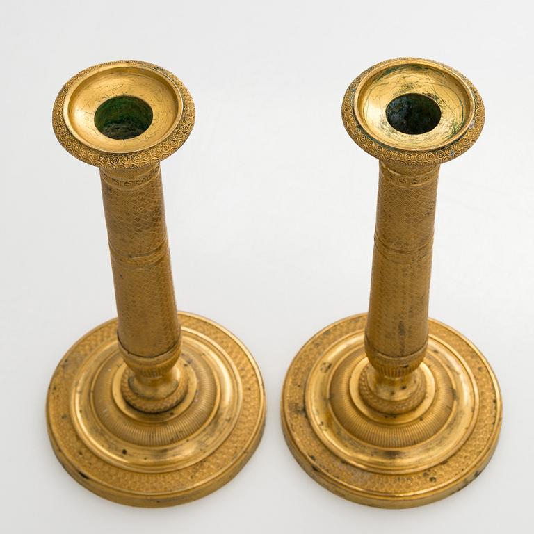 A pair of early 19th century French Empire candlesticks.