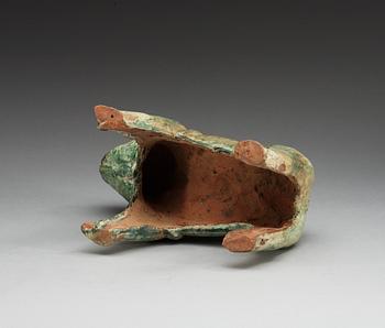 A green glazed figure of a Tibethan dog, Han dynasty (206 BC-220 AD).