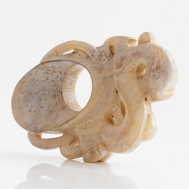 An archaistically carved nephrite sculpture, China, 20th Century.