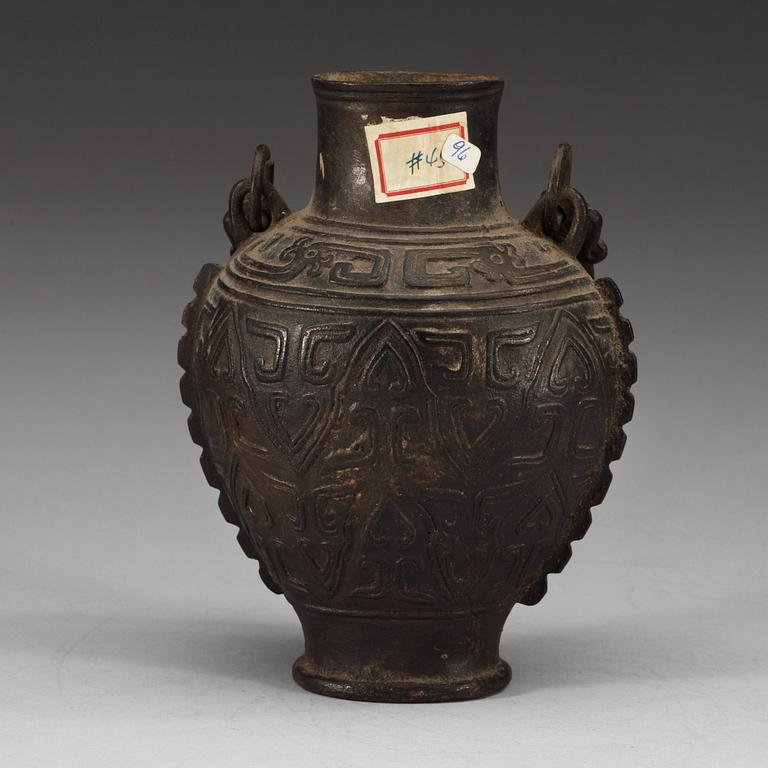 An archaistic bronze vase with a handle, presumably Ming dynasty.