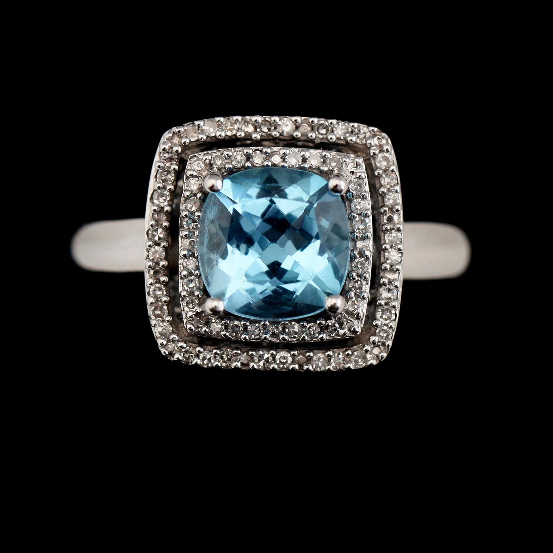 RING, 14K vitguld, diamanter tot ca 0.17 ct och topas. Total vikt ca 5 g.
