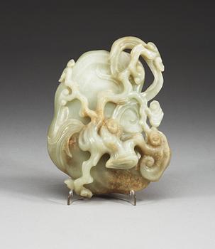 A large pale celadon nephrite brush washer with a wooden stand, Qing dynasty.