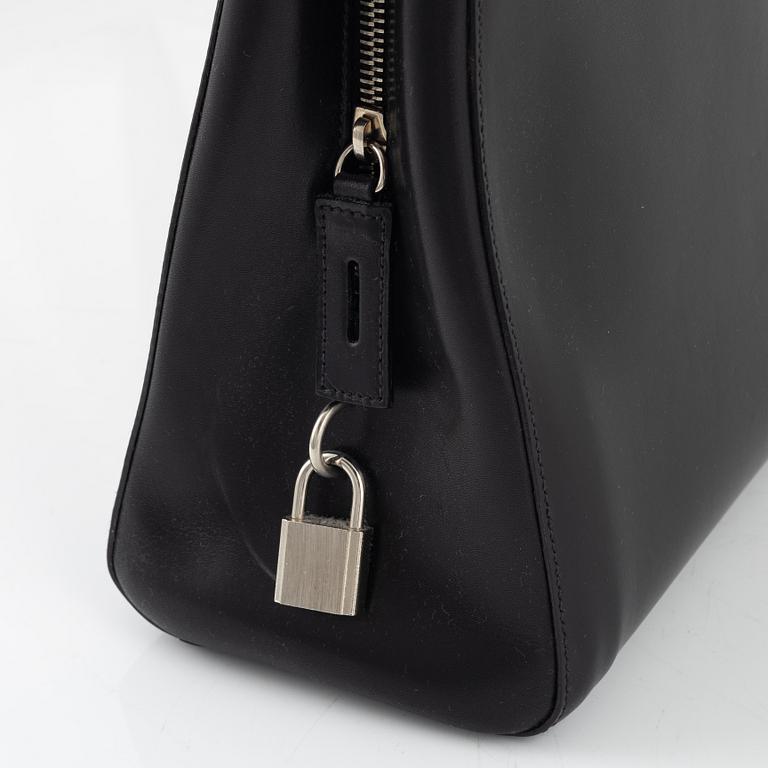 Prada, a black leather bag.