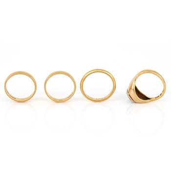 RINGAR, 4 st, 23K guld med sannolikt syntetisk grön spinell, Stockholm, 1900-tals. Total vikt ca 24,40 g.