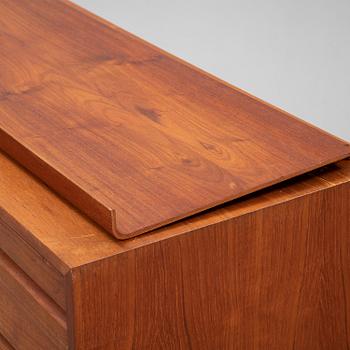 A 1960's teak shelving system by Poul Cadovius.