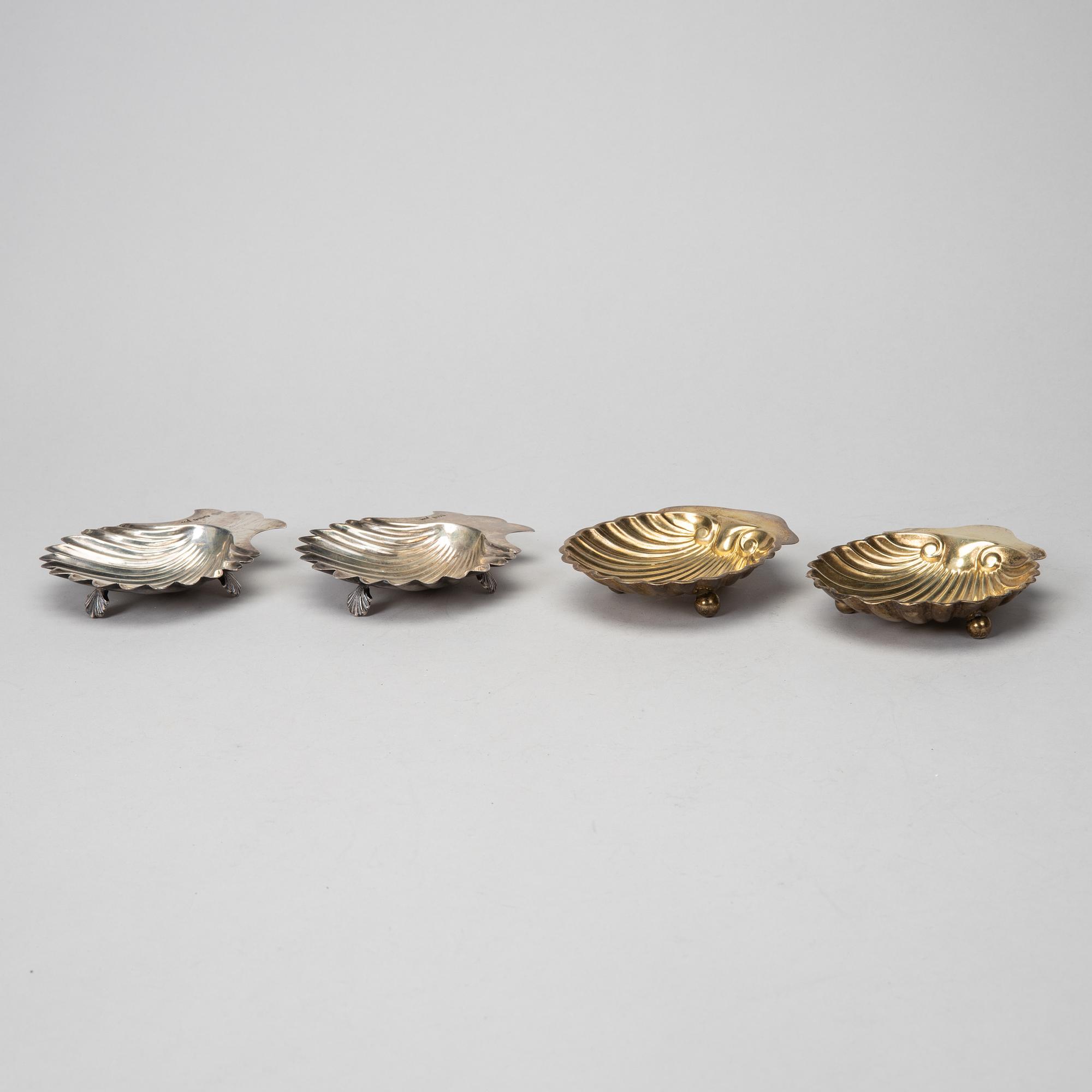 Two pairs of silver butter-shells, mark of Sheffield 1899, Birmingham 1905, & London 1914.