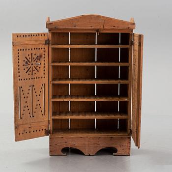 A late 19th century pine cupboard for eggs.