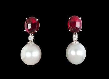 924. A pair of cultured South sea pearl and rubellite earrings.