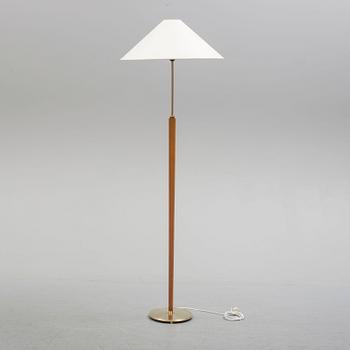 A Bergboms brass and beech standard light, 1940's.