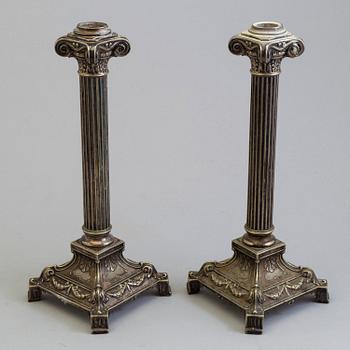 A pair of plated candel sticks from the fist half of the 20th century.