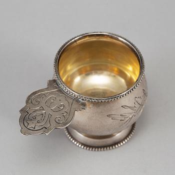 A Russian parcel-gilt silver vodka cup, Moscow 1888.