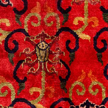 An East Turkestan silk carpet, c. 308 x 182 cm.