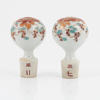 A set of Japanese porcelain bottles with stoppers, early 20th century.