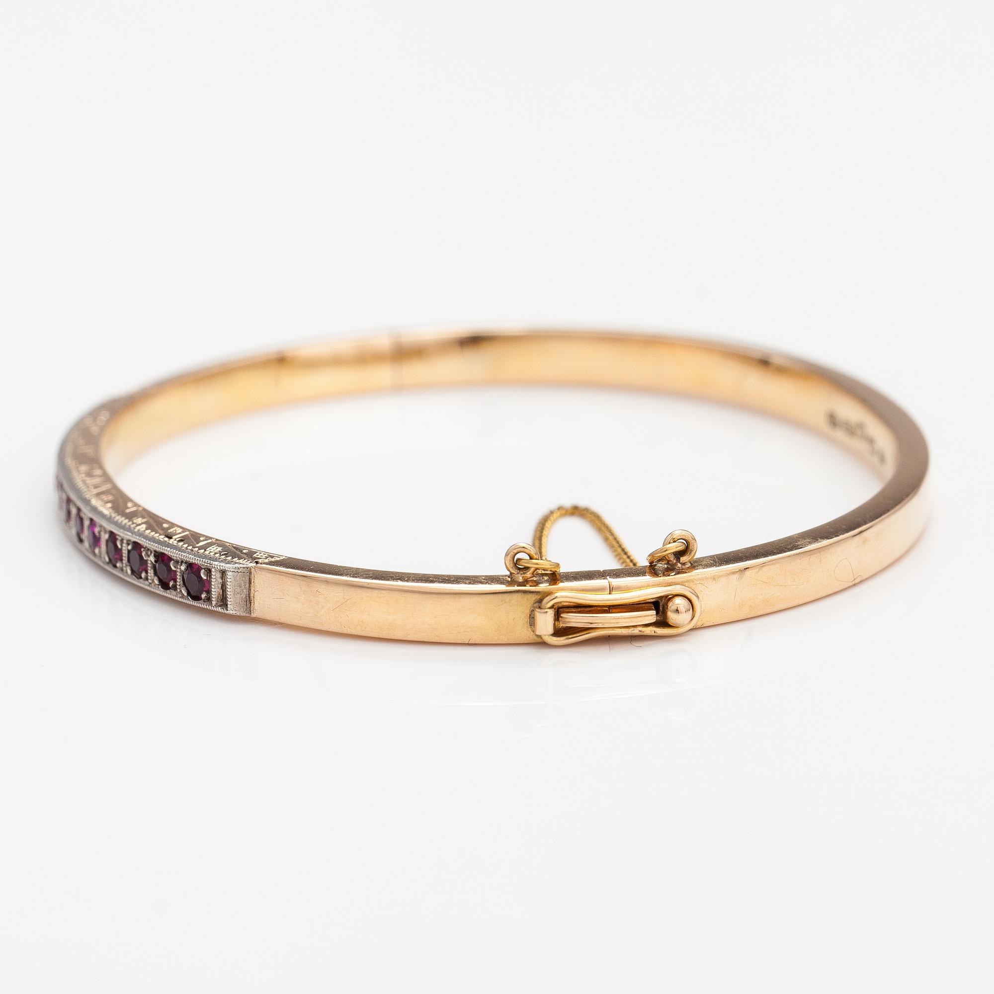 ARMBAND, 14K guld, syntetiska rubiner. Tarkkanen Oy, Helsingfors 1959.
