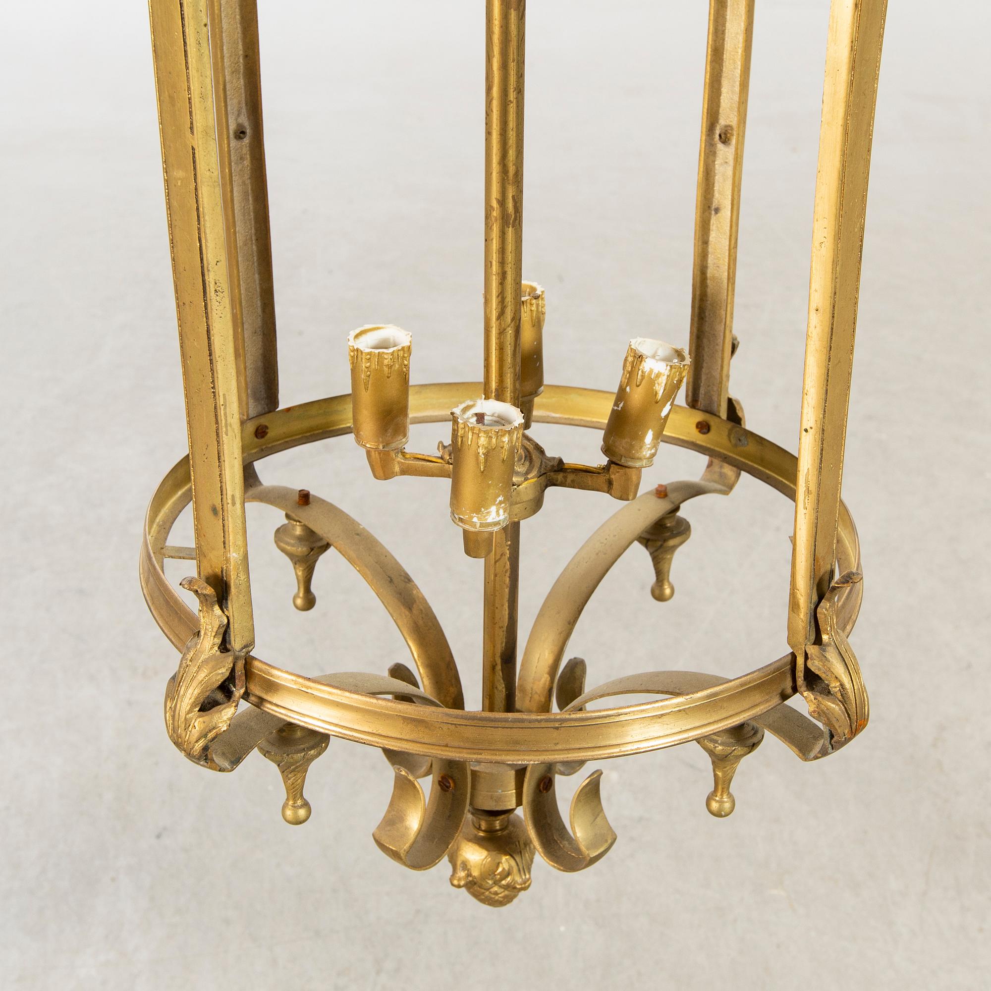 A 20th century brass ceiling lamp in Louis XV-style.