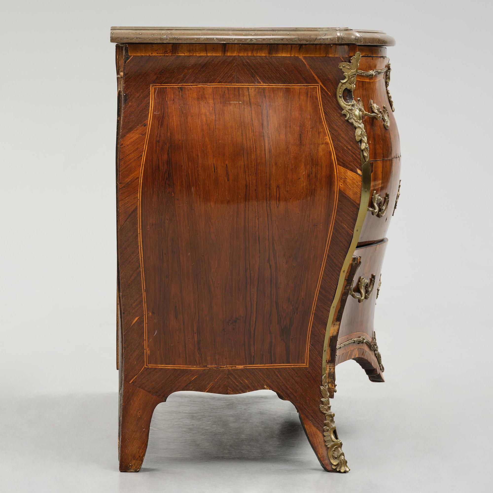 A rococo parquetry commode by C. G. Willkom (master in Stockholm 1763-65).