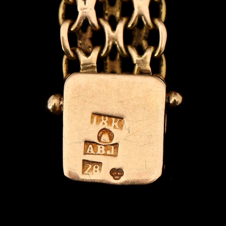 ARMBANDSUR, 18K guld, Marvin, 1900-talets mitt. Total vikt ca 26 g.