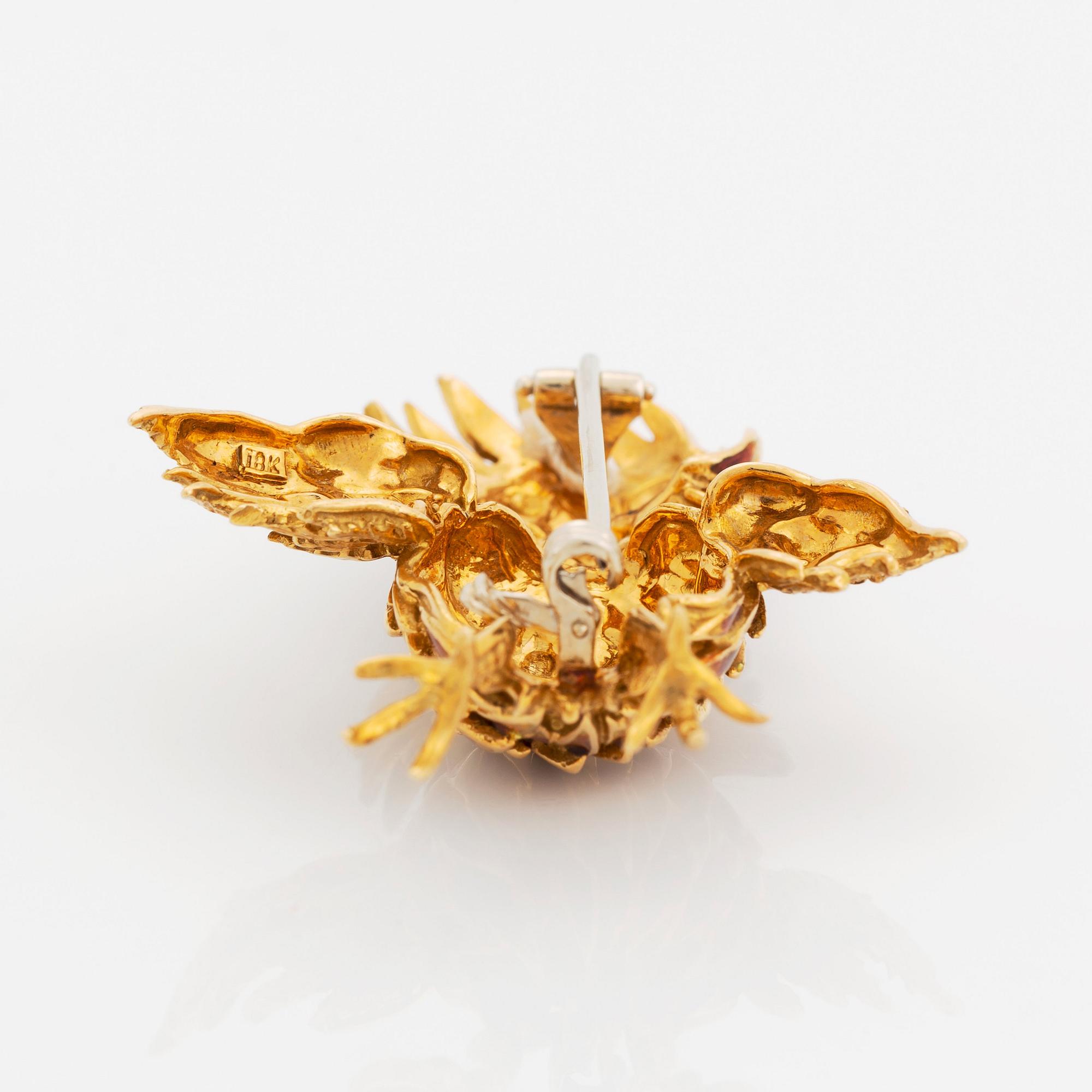 Brosch 18K guld och emalj med åttkantslipade diamanter.