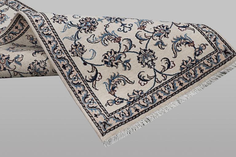 A runner carpet, Nain, part silk, ca 192 x 80 cm.