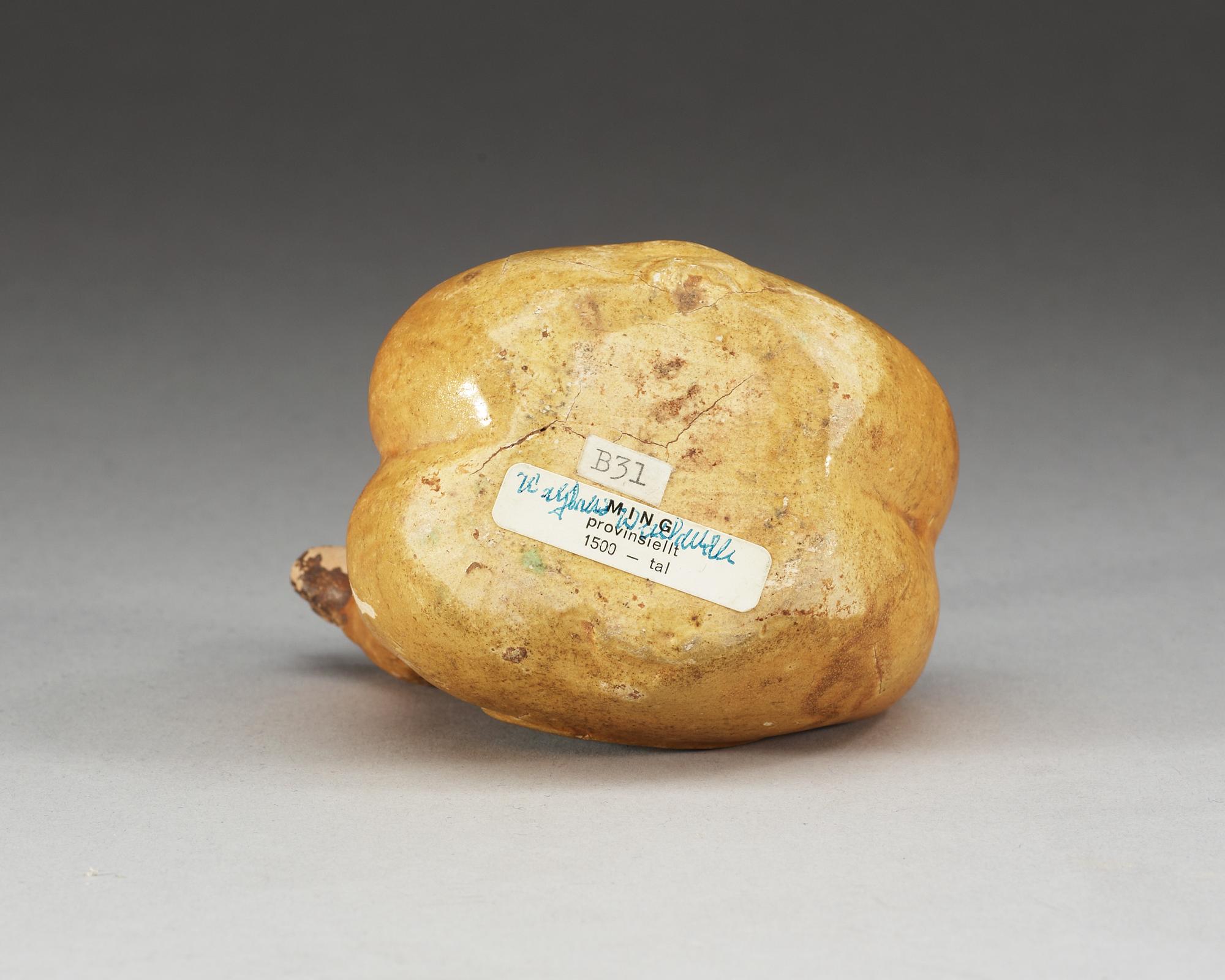 A yellow and green glazed figurine of two mandarin ducks. Ming dynasty ( 1368-1644).