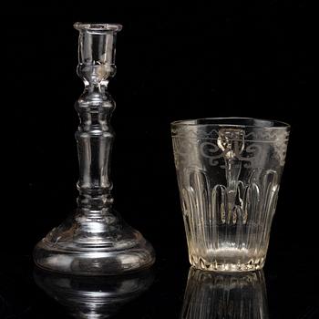 A glass cup with handle and a glass candle stick, 18/19th Century.